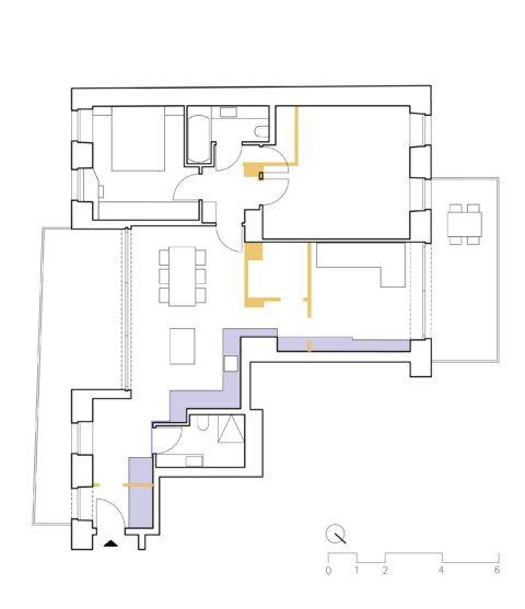 Floor plan of a renovated apartment with highlighted built-in furniture